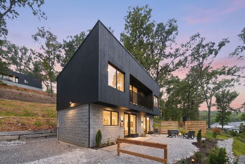 Birdhouses two-story cabin exterior at dusk